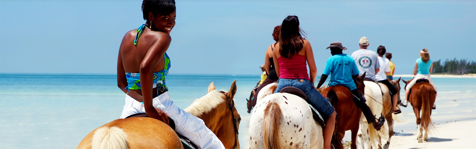 Horseback riding on a beach